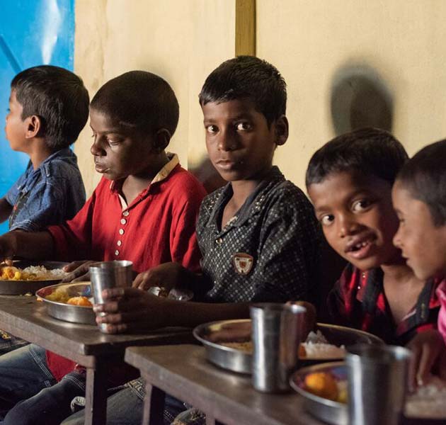 Boys sitting and eating a nutritional meal