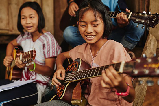 Children playing guitar