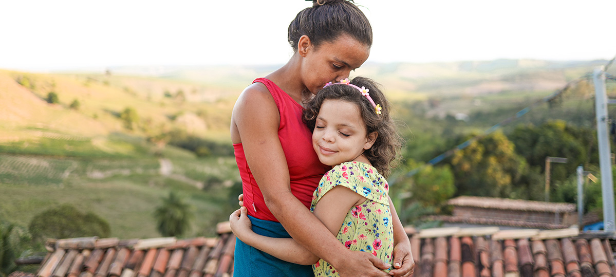 A mother and daughter hug