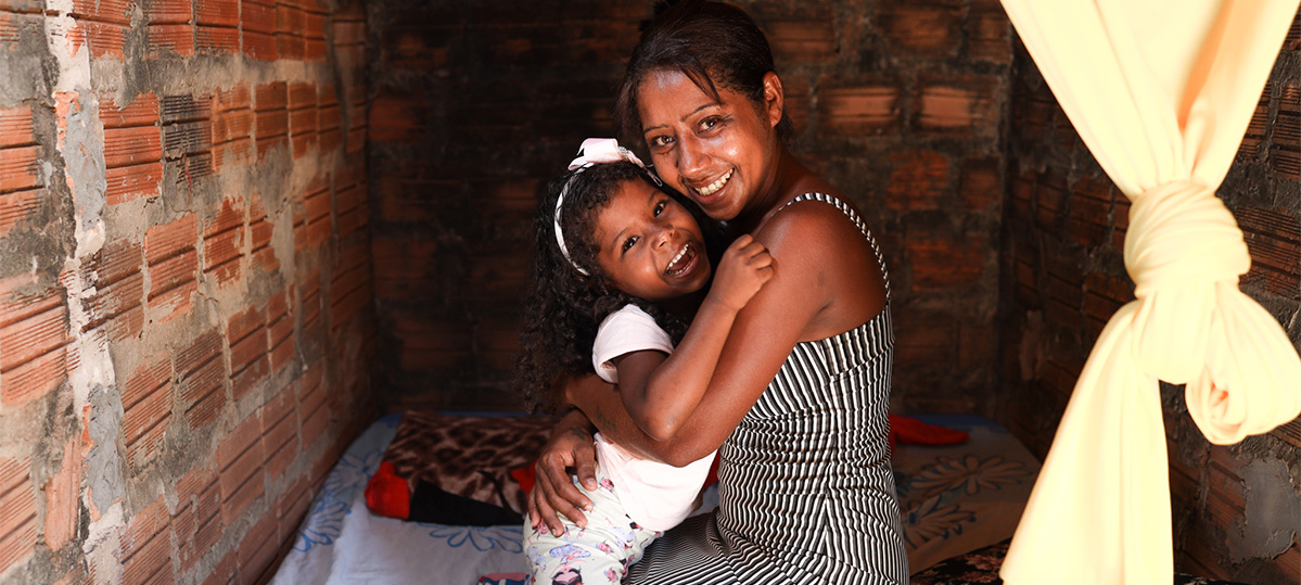 A mother and daughter hug