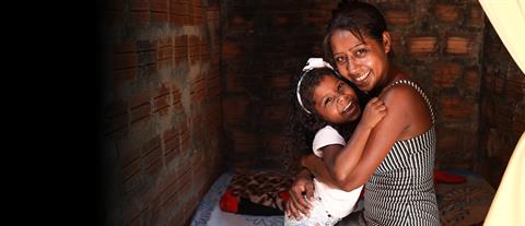 a mother and daughter hug each other