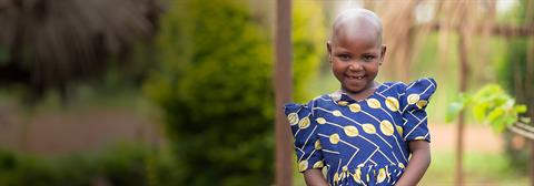 a girl smiles at the camera