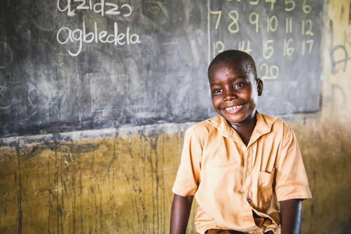 A kid sits in a classroom