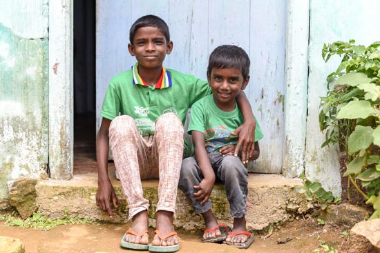 Brothers sitting on a door step