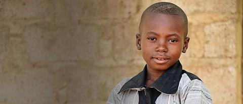 A young boy in a polo shirt