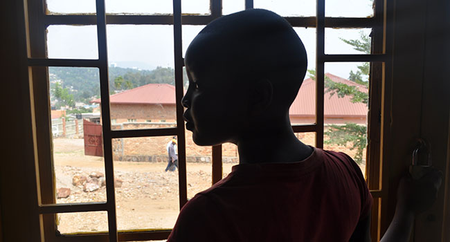 Child looking out a window