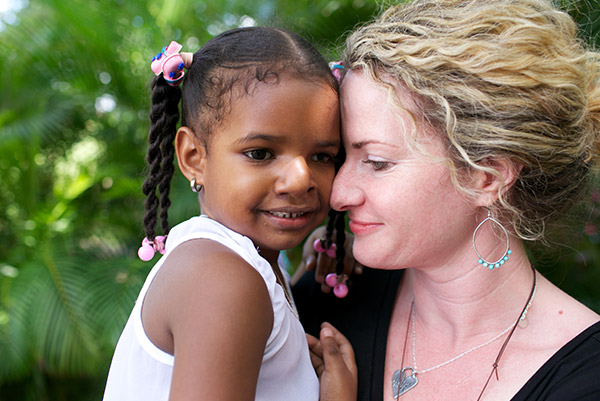 Woman holds a child