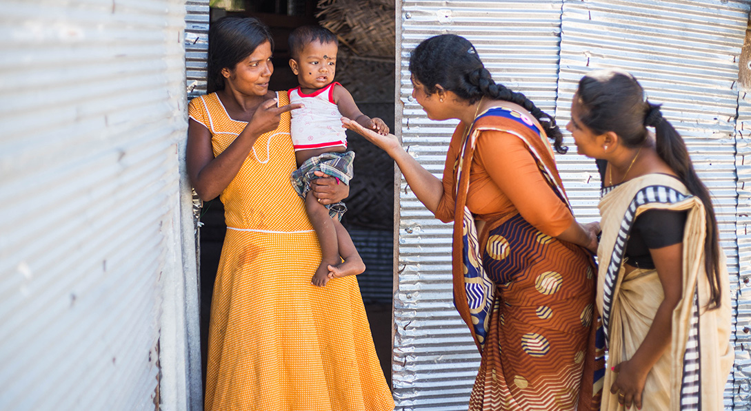 Sasiliya and baby are visited by 2 Compassion Survival initiative workers