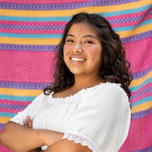 a girl smiles at the camera