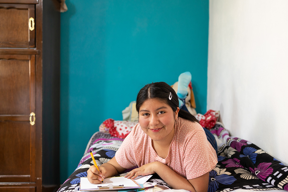 a girl writes a letter to her sponsor