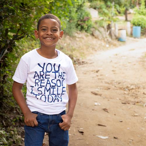 Child smiles at camera