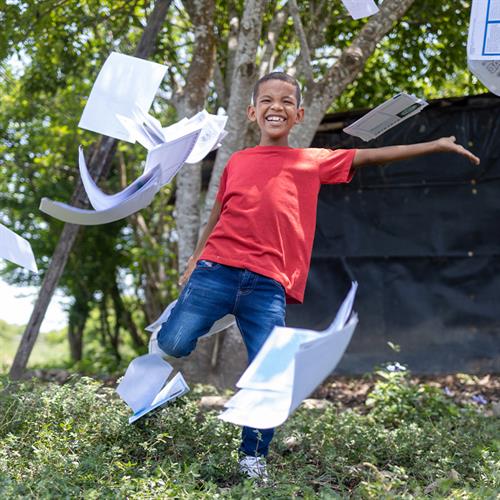 Child dancing with letters