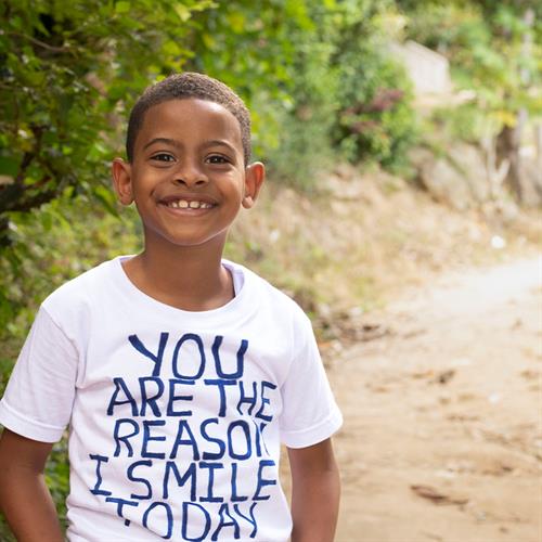 Child smiles at camera