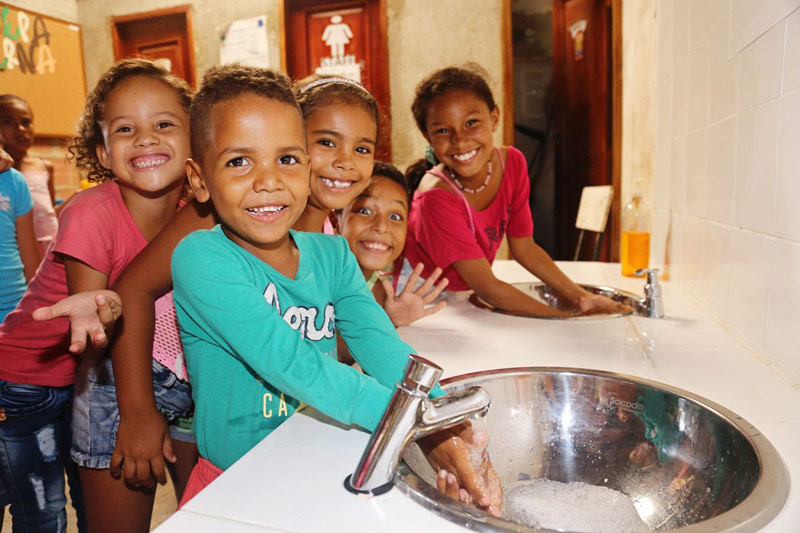 Children wash their hands