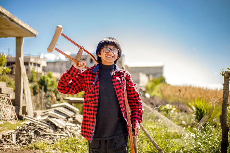 A boy who faces a rare bone disease smiles with hope