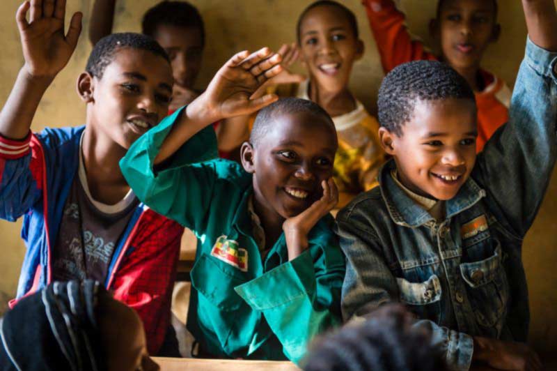 Children happily engage in the classroom