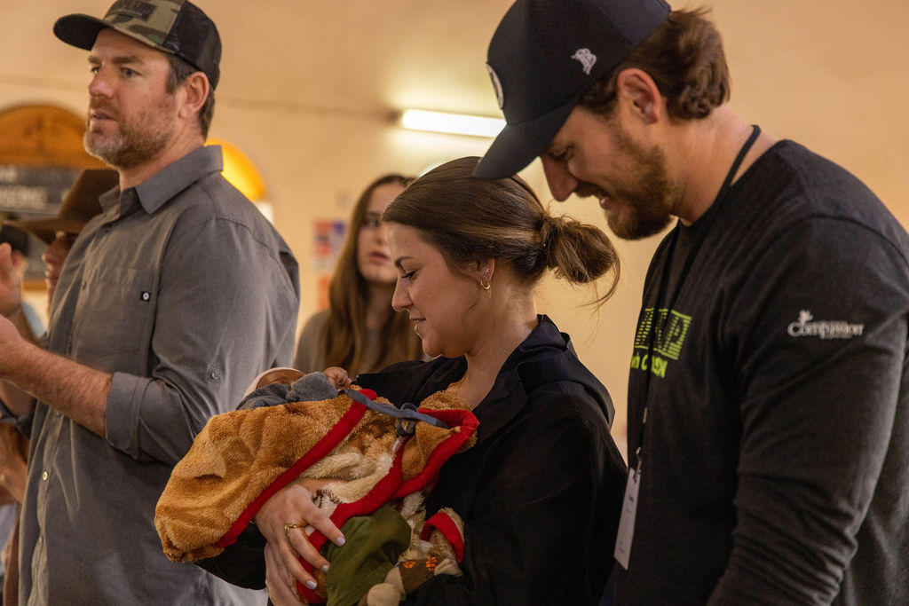 Man and woman holding a baby