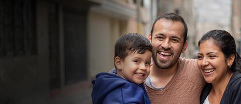 A smiling mother, father and son