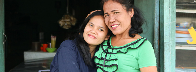 a mother and daughter hug