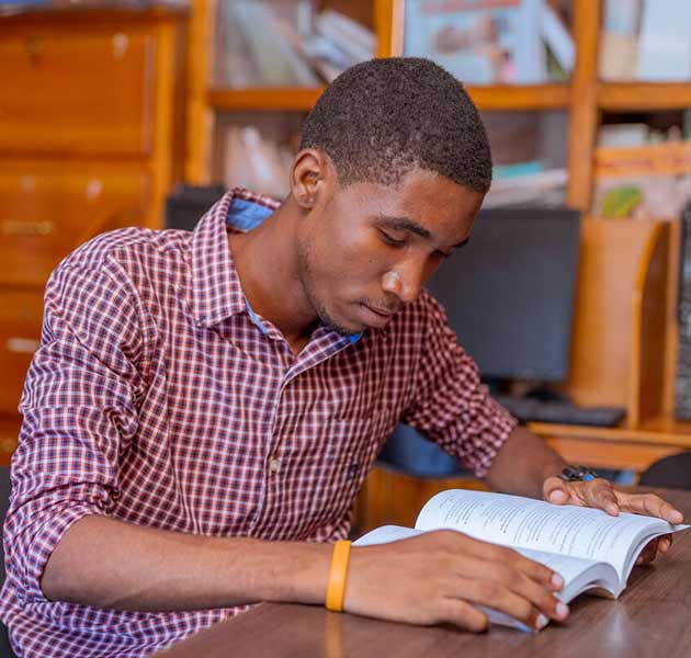 A young man studying the bible