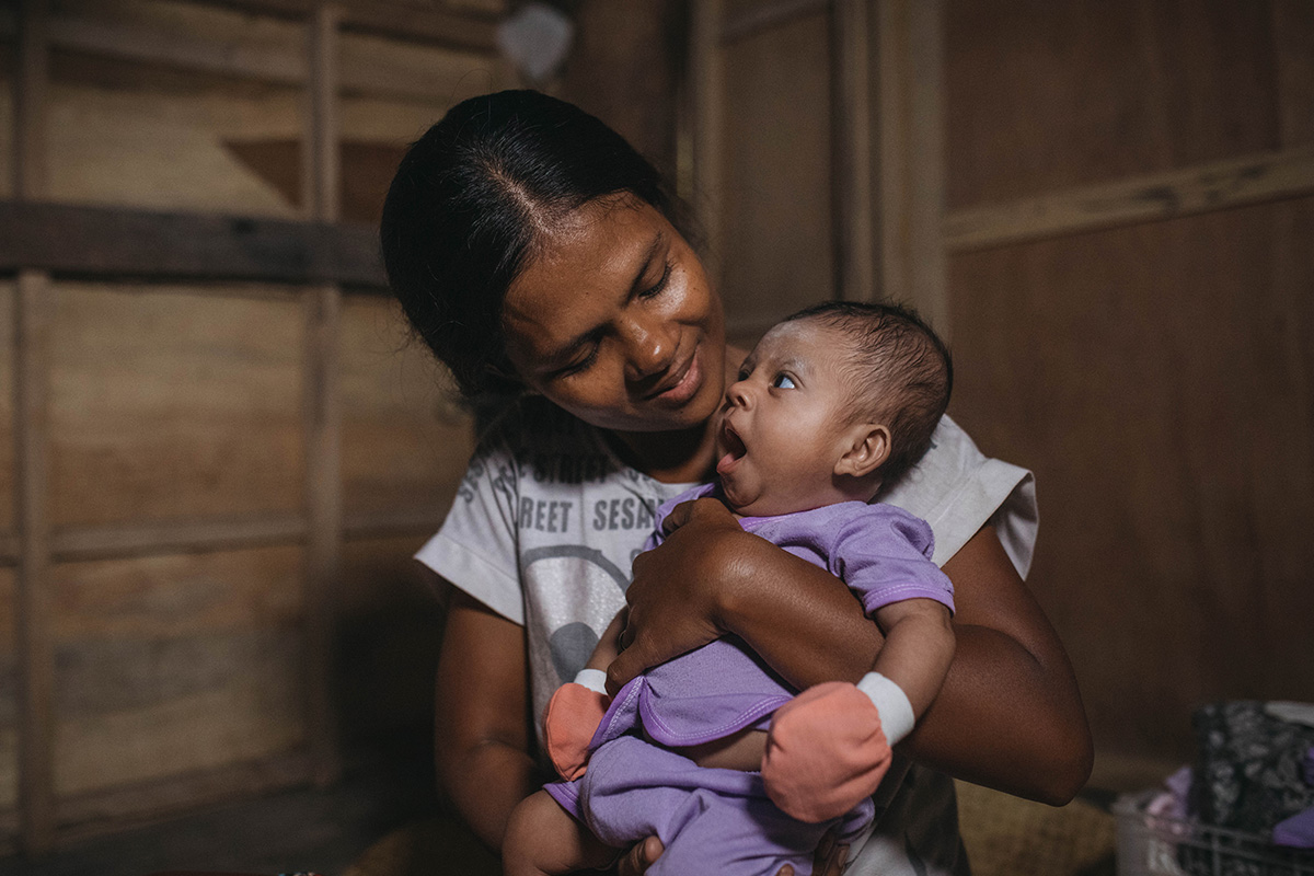 Barbalinda holds her baby, Adiva