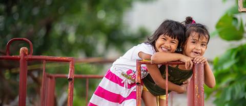 Two girls hugging