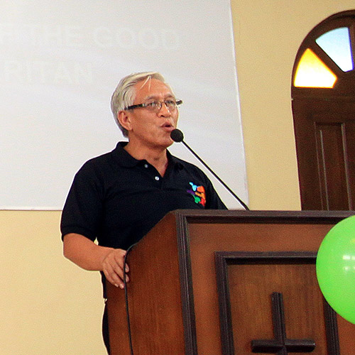 a man speaking at a church