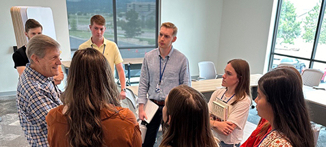 A group of Compassion employees in the conference room