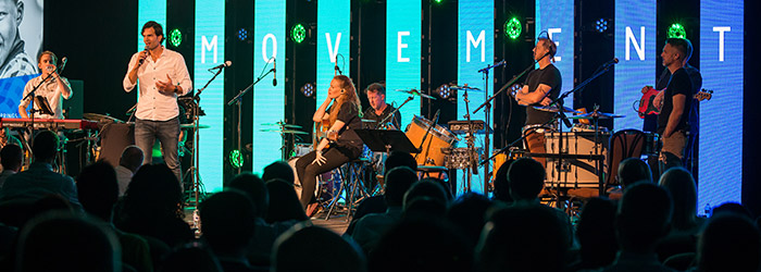 A band plays on a stage