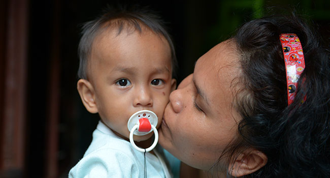 Mom holding your boy