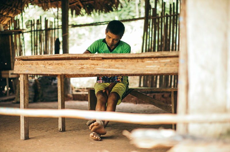 A young man working at a desk