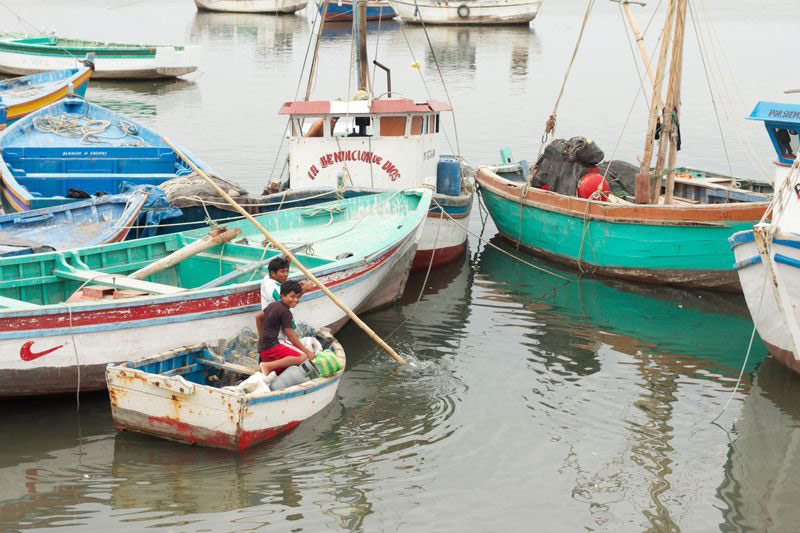 Two boys have fun in a boat