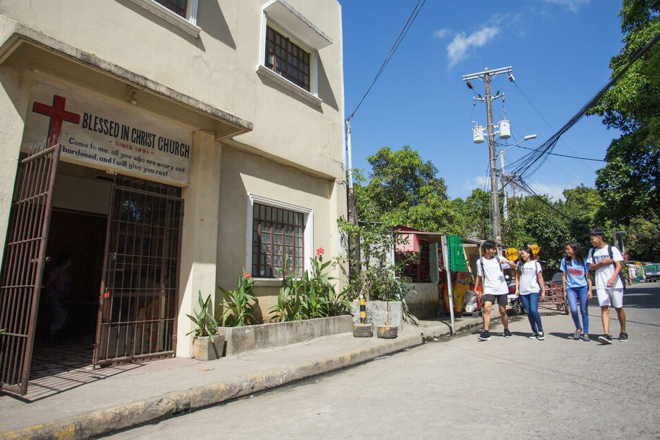 Students walk towards a church