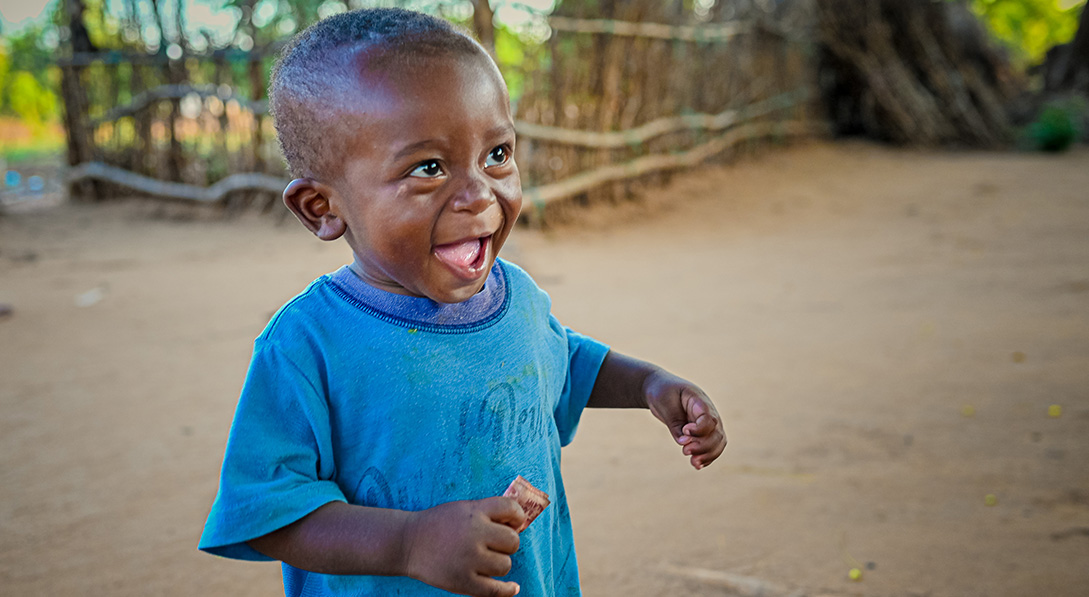 boy smiling and running 