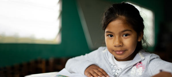 A girl reading her sponsor letter