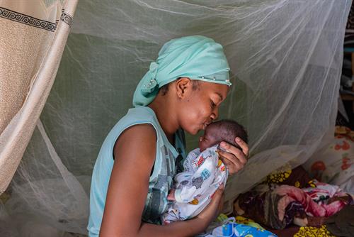 Mother holding new born baby