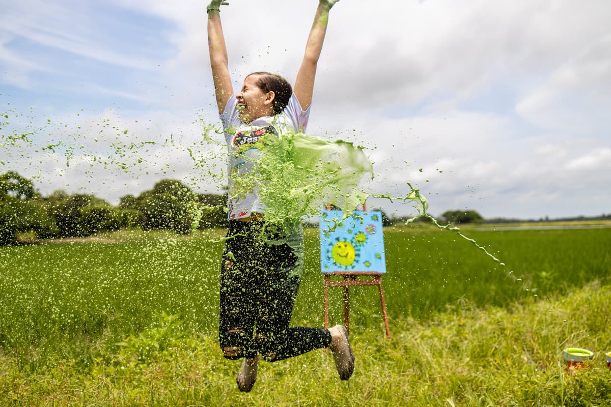 A girl celebrating with paint