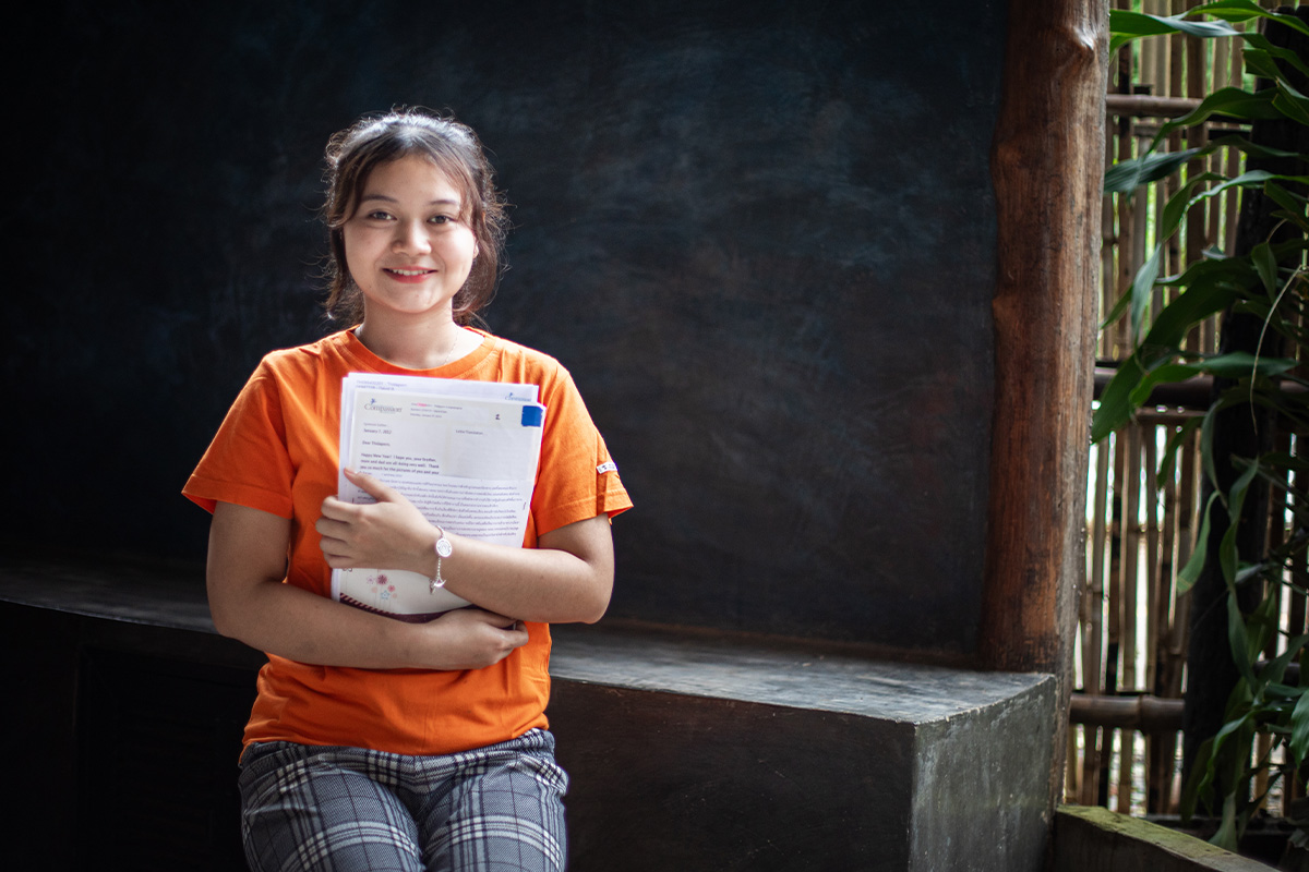 girl holds letter close