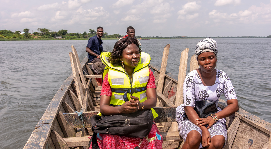 two women sitting in boat