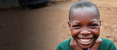 A young boy smiling