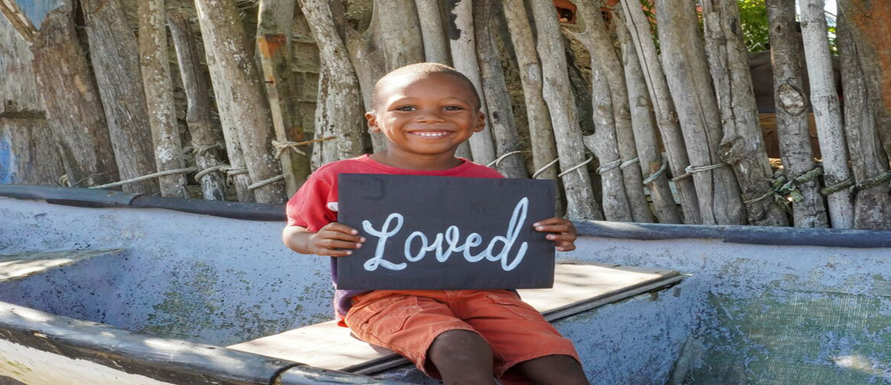 child holding sign