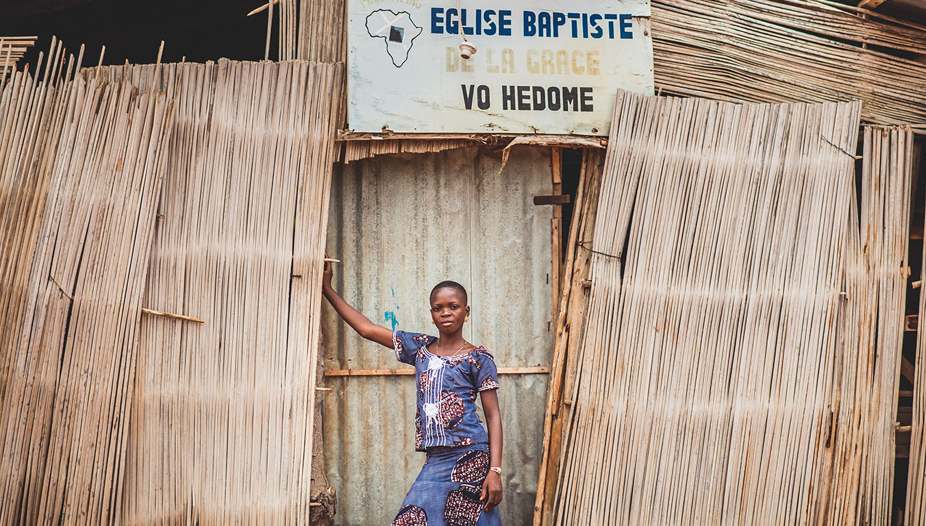 Ablavi outside the church that runs her Compassion program