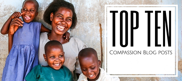 A woman and three children smile and laugh together