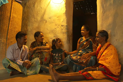 a family sits on the floor together