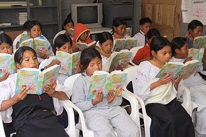 a group of children reading books