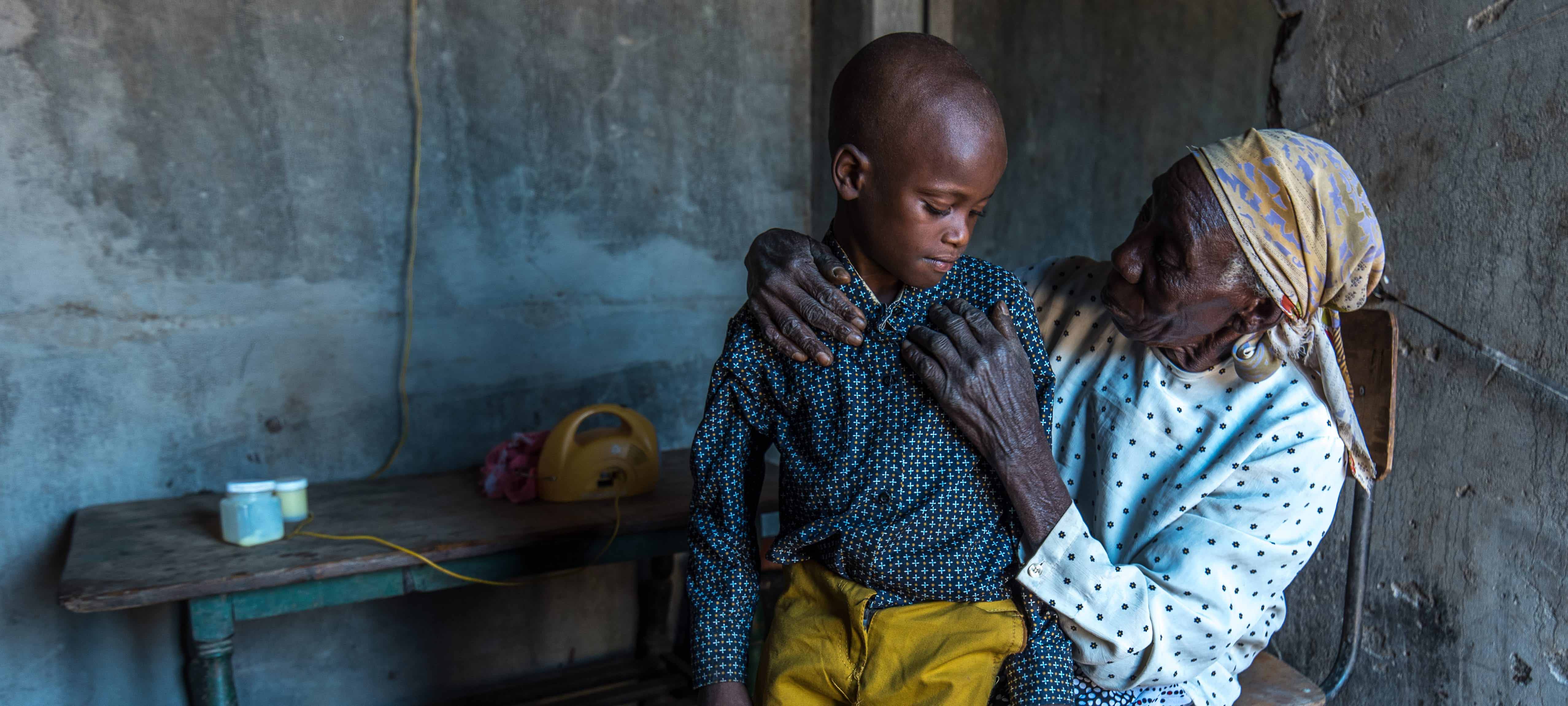 Mom reading the bible to child in poverty