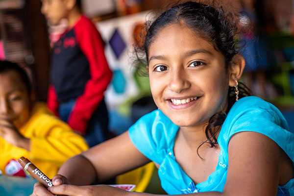 A young child smiling