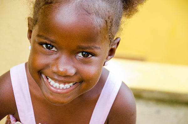 A young child smiling