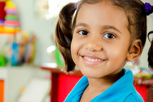 A young child smiling