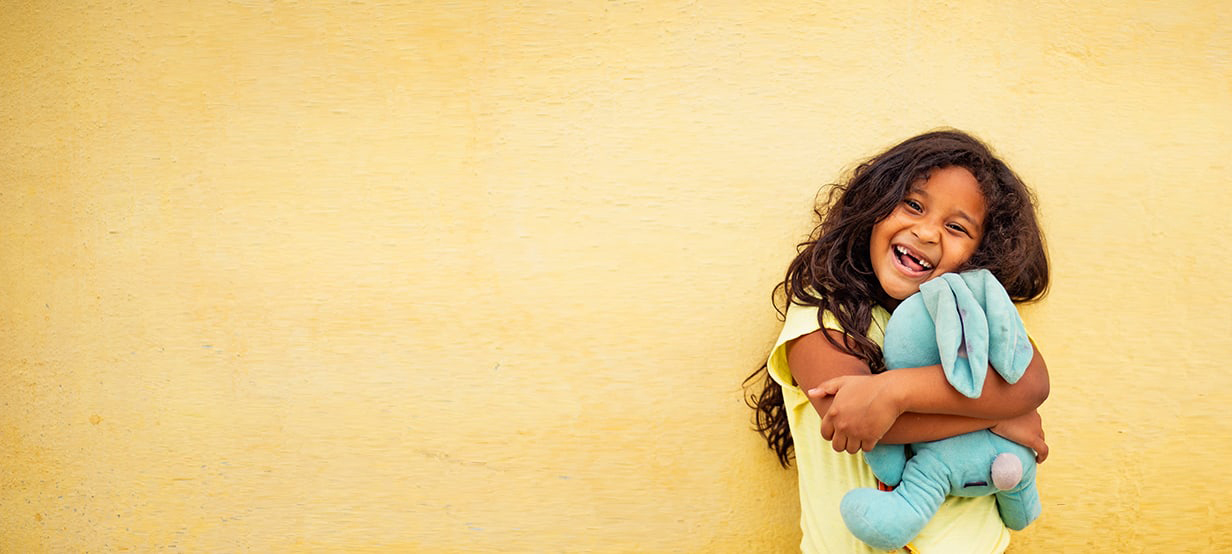 Two children jumping for joy